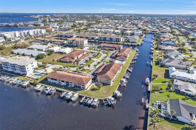 drone / aerial view featuring a residential view and a water view