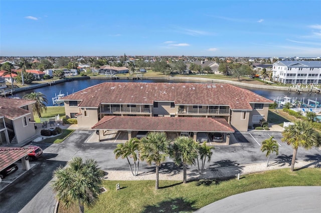 bird's eye view with a residential view and a water view