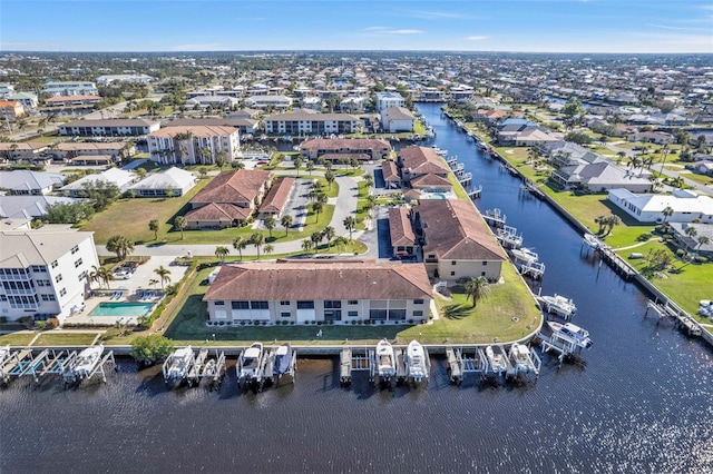 birds eye view of property with a residential view and a water view