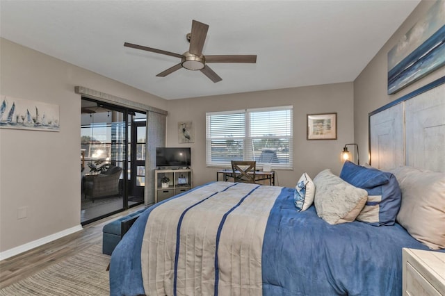 bedroom with access to outside, ceiling fan, baseboards, and wood finished floors