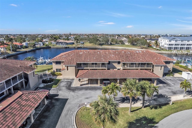 aerial view with a residential view and a water view