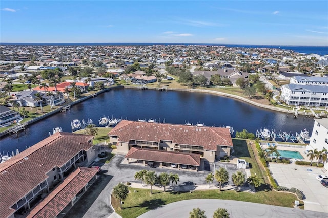 aerial view featuring a residential view and a water view