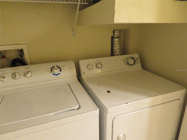 laundry area with washing machine and clothes dryer