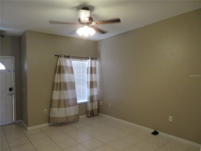 entryway with ceiling fan and light tile patterned floors