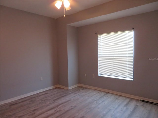 empty room with light hardwood / wood-style floors