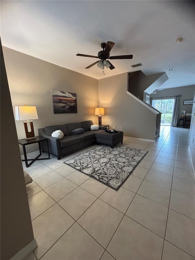 living room featuring ceiling fan and light tile patterned floors