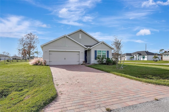 view of front of house featuring a front lawn and a garage