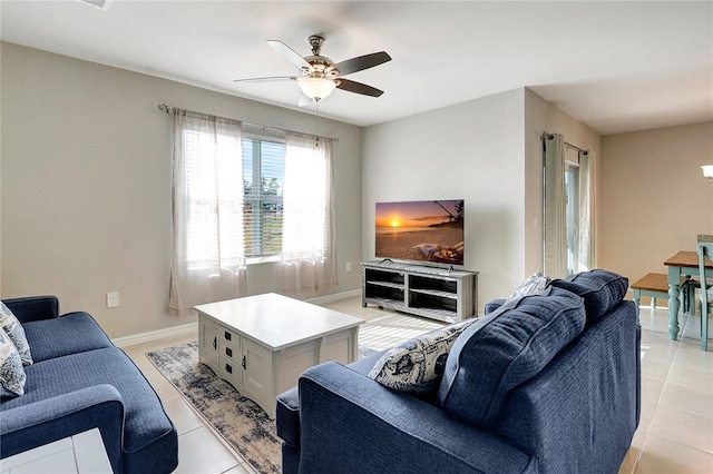 tiled living room with ceiling fan