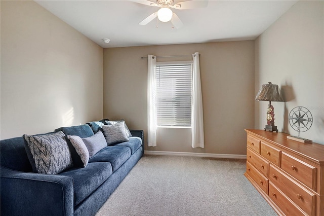 carpeted living room featuring ceiling fan