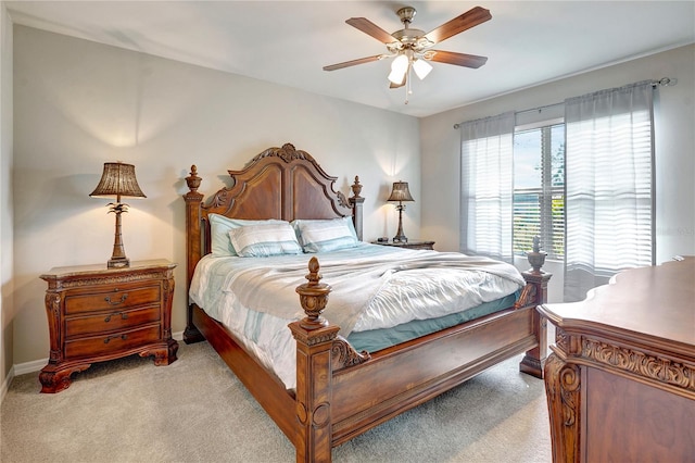 bedroom featuring ceiling fan and light carpet