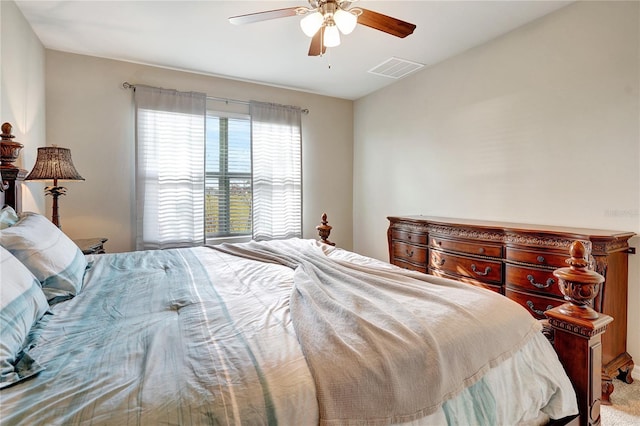 bedroom with light colored carpet and ceiling fan