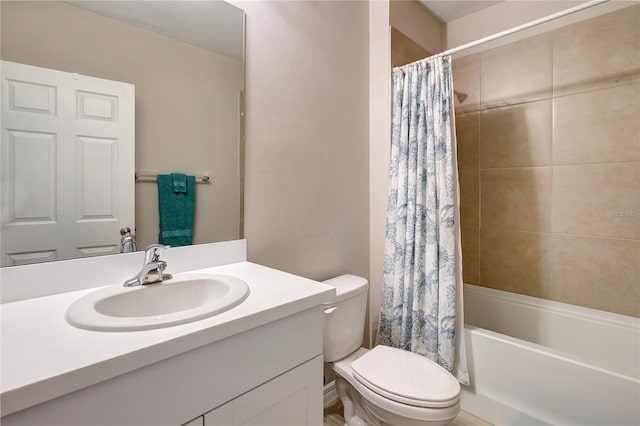 full bathroom with vanity, shower / tub combo, and toilet