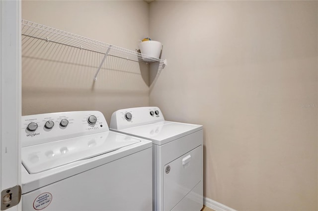 laundry room with washer and dryer