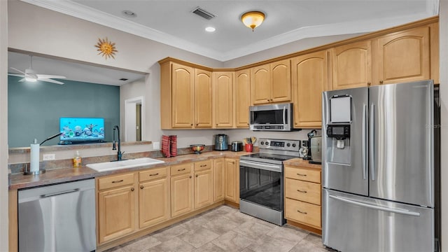 kitchen with ceiling fan, sink, crown molding, light brown cabinetry, and appliances with stainless steel finishes