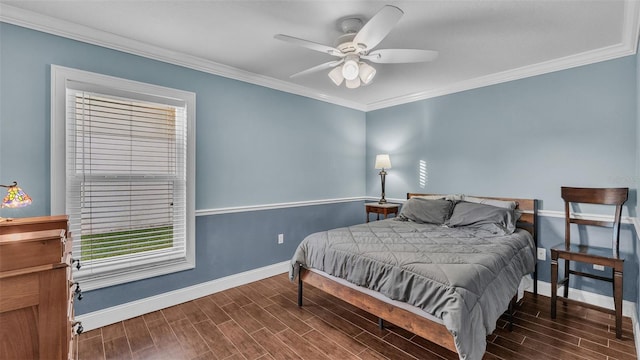 bedroom with dark hardwood / wood-style floors, ceiling fan, and crown molding