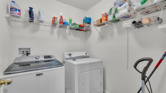 washroom with washer and clothes dryer