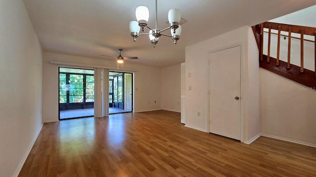 2000 Forrest Nelson Blvd Unit C8, Port Charlotte, FL 33952 - spare room featuring wood finished floors, a chandelier, baseboards, and ceiling fan