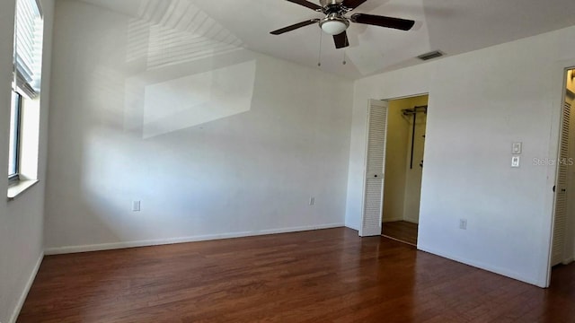 unfurnished room featuring dark hardwood / wood-style flooring and ceiling fan