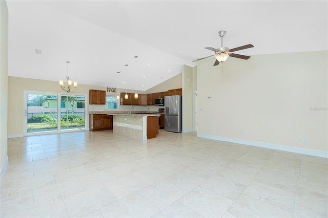 unfurnished living room with light tile patterned floors, high vaulted ceiling, and ceiling fan with notable chandelier