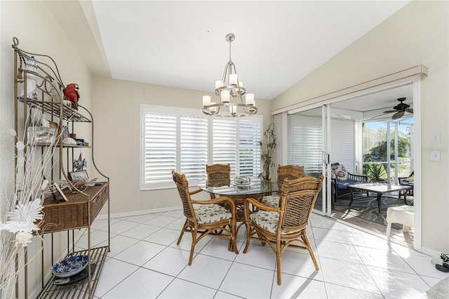 tiled dining room with ceiling fan with notable chandelier and vaulted ceiling