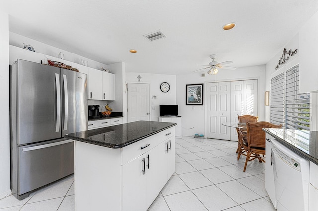 kitchen with ceiling fan, a center island, stainless steel fridge, white dishwasher, and white cabinets