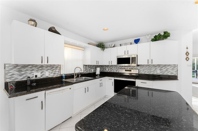 kitchen featuring white cabinetry, plenty of natural light, stainless steel appliances, and sink