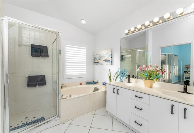 bathroom with plus walk in shower, tile patterned floors, vanity, and vaulted ceiling