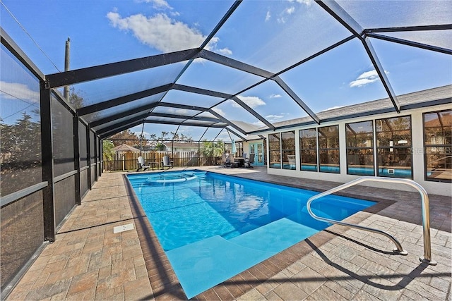 view of swimming pool with a lanai and a patio area