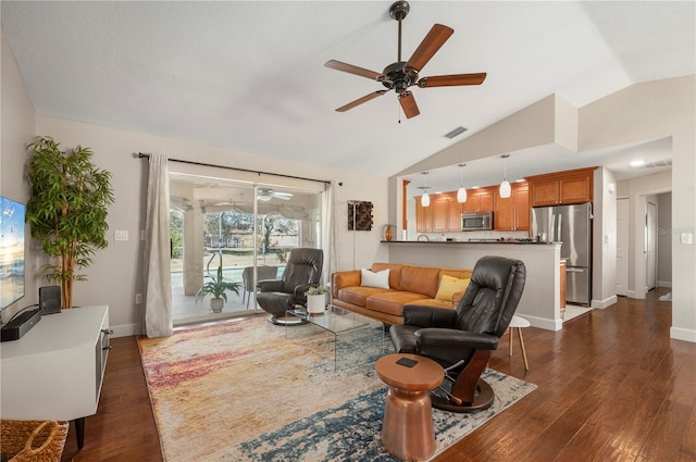 living room with ceiling fan, dark hardwood / wood-style flooring, and vaulted ceiling