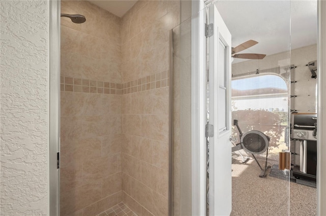 bathroom featuring a tile shower