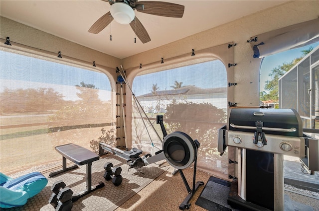 workout area with ceiling fan