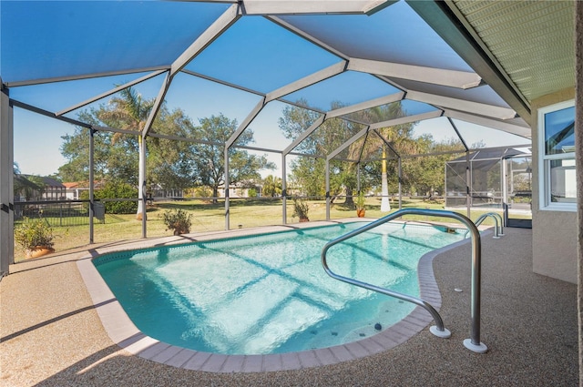 view of pool with a lawn and glass enclosure