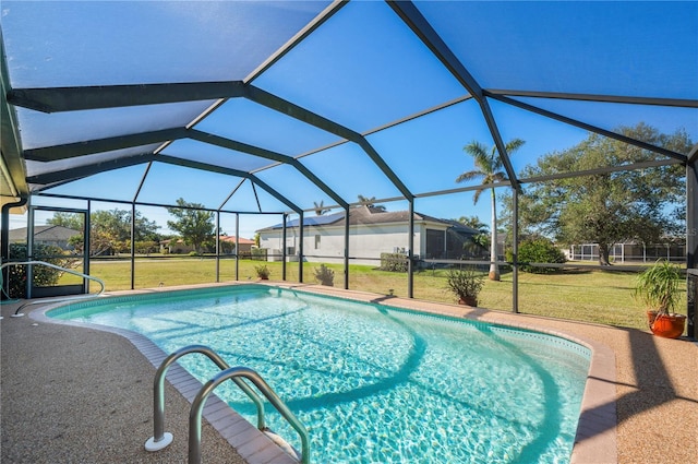 view of swimming pool with a lanai and a lawn