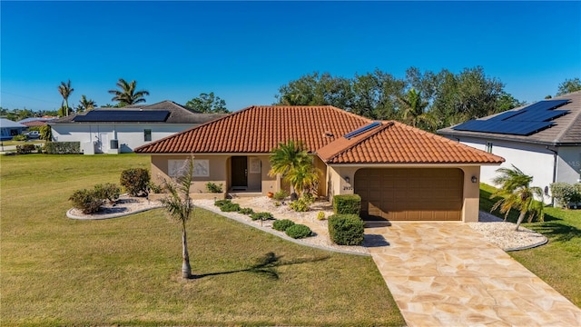 view of front of property with a garage and a front lawn