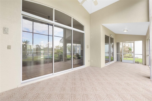 interior space featuring ceiling fan and vaulted ceiling