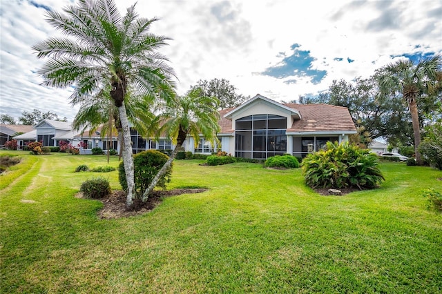 view of yard featuring a sunroom