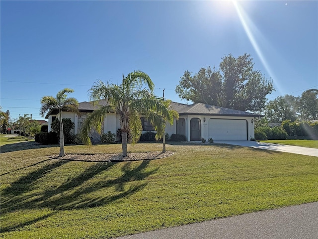 ranch-style home featuring a front yard and a garage