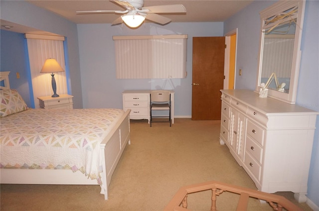 bedroom featuring ceiling fan and light colored carpet