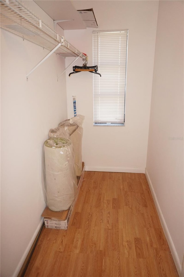 spacious closet with light wood-type flooring