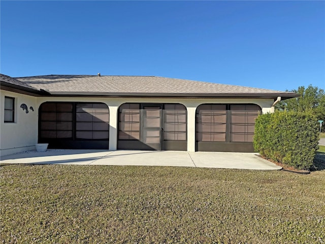 garage with a lawn