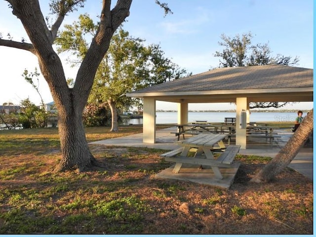 view of property's community with a gazebo and a water view