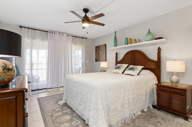 tiled bedroom featuring ceiling fan