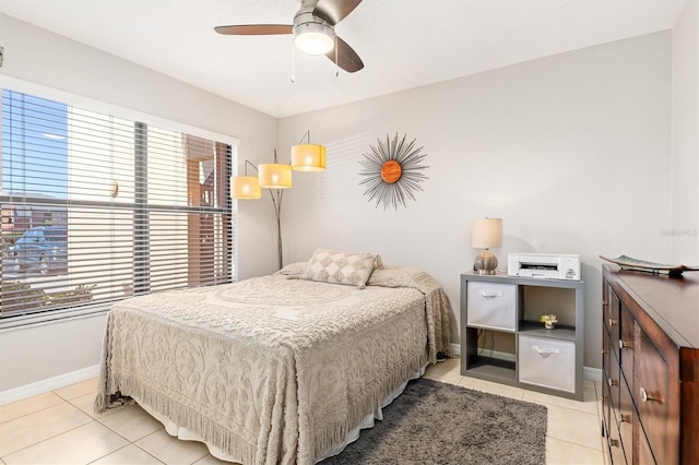 bedroom with light tile patterned floors and ceiling fan