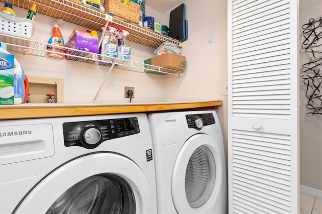 clothes washing area featuring separate washer and dryer