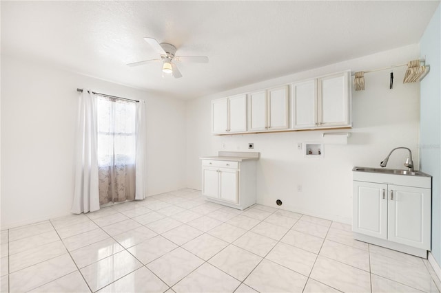 washroom with ceiling fan, sink, cabinets, washer hookup, and electric dryer hookup