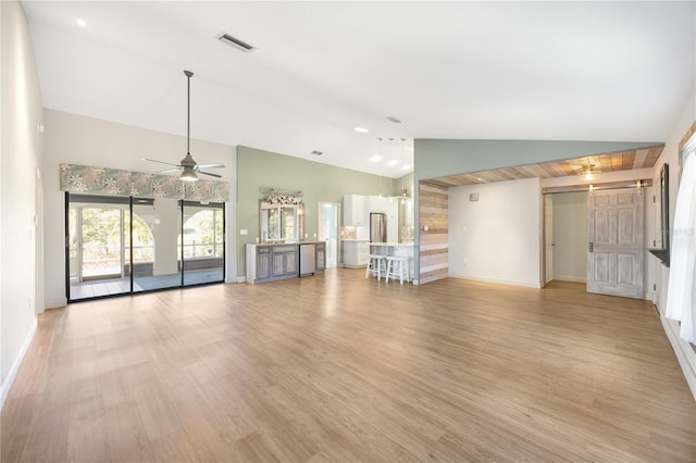 unfurnished living room with light wood-type flooring, high vaulted ceiling, and ceiling fan