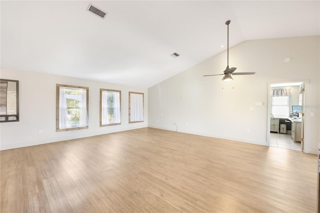 unfurnished living room featuring light hardwood / wood-style floors, high vaulted ceiling, and ceiling fan