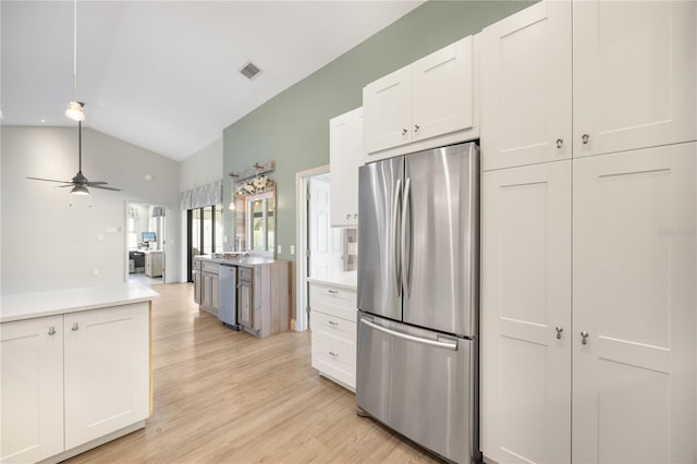 kitchen featuring ceiling fan, light hardwood / wood-style floors, white cabinetry, and appliances with stainless steel finishes