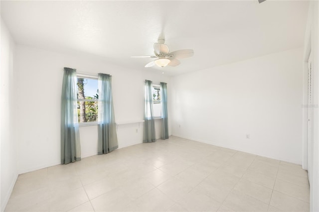 unfurnished room with ceiling fan