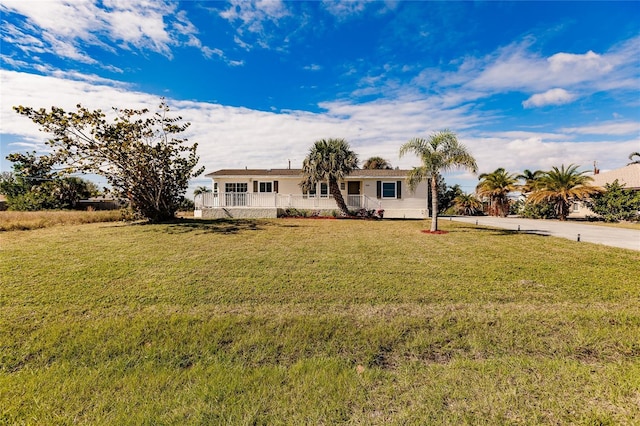 ranch-style home with a front yard